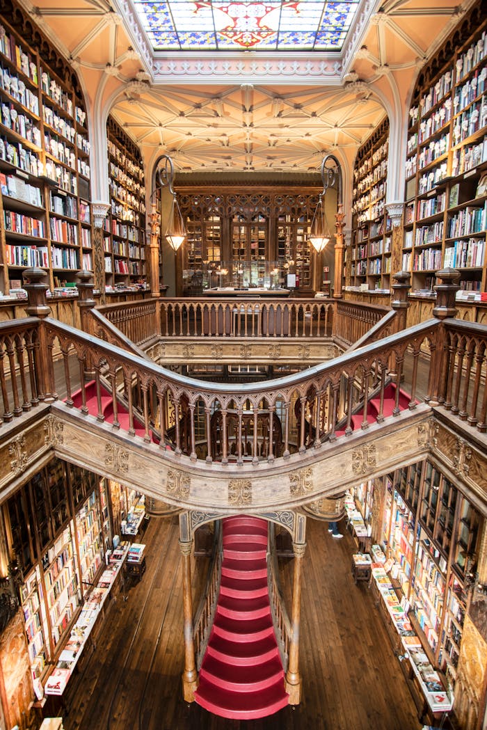 services-04 Stunning view of the iconic Livraria Lello's grand staircase and bookshelves in Porto, Portugal.
